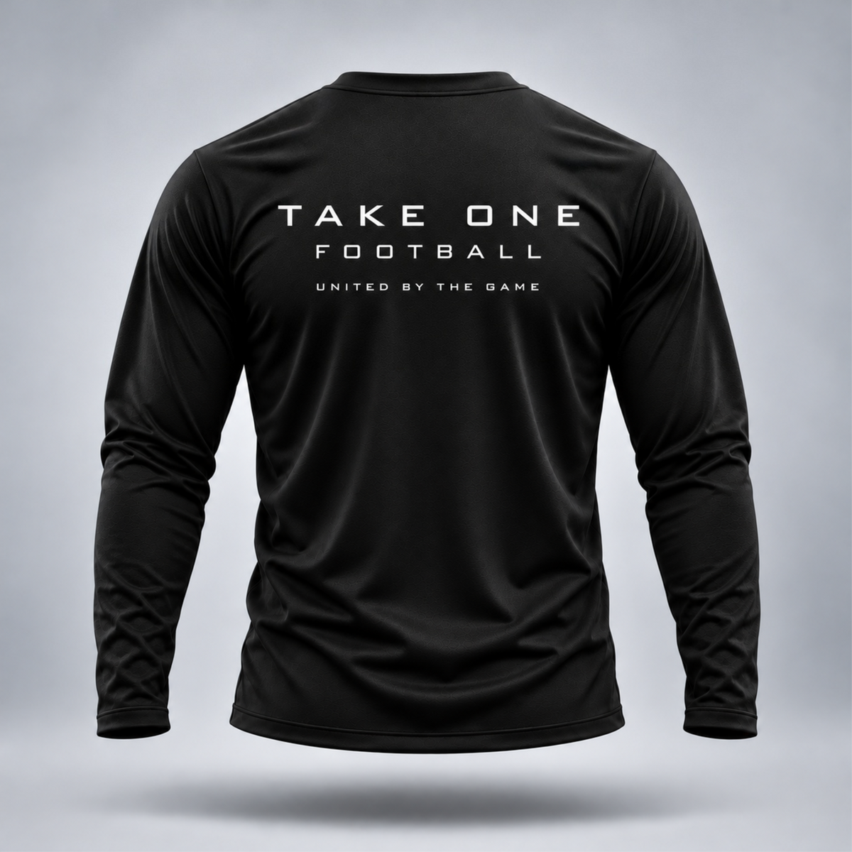 Take One Sportswear black Football Long Sleeve Performance Tee back view featuring TAKE ONE FOOTBALL and United By The Game graphics