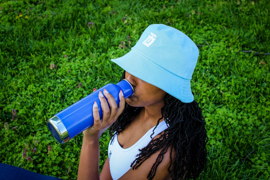 Take One New Age Bucket Hat with embroidered logo, breathable eyelets, and sun-shielding brim for stylish protection on and off the field