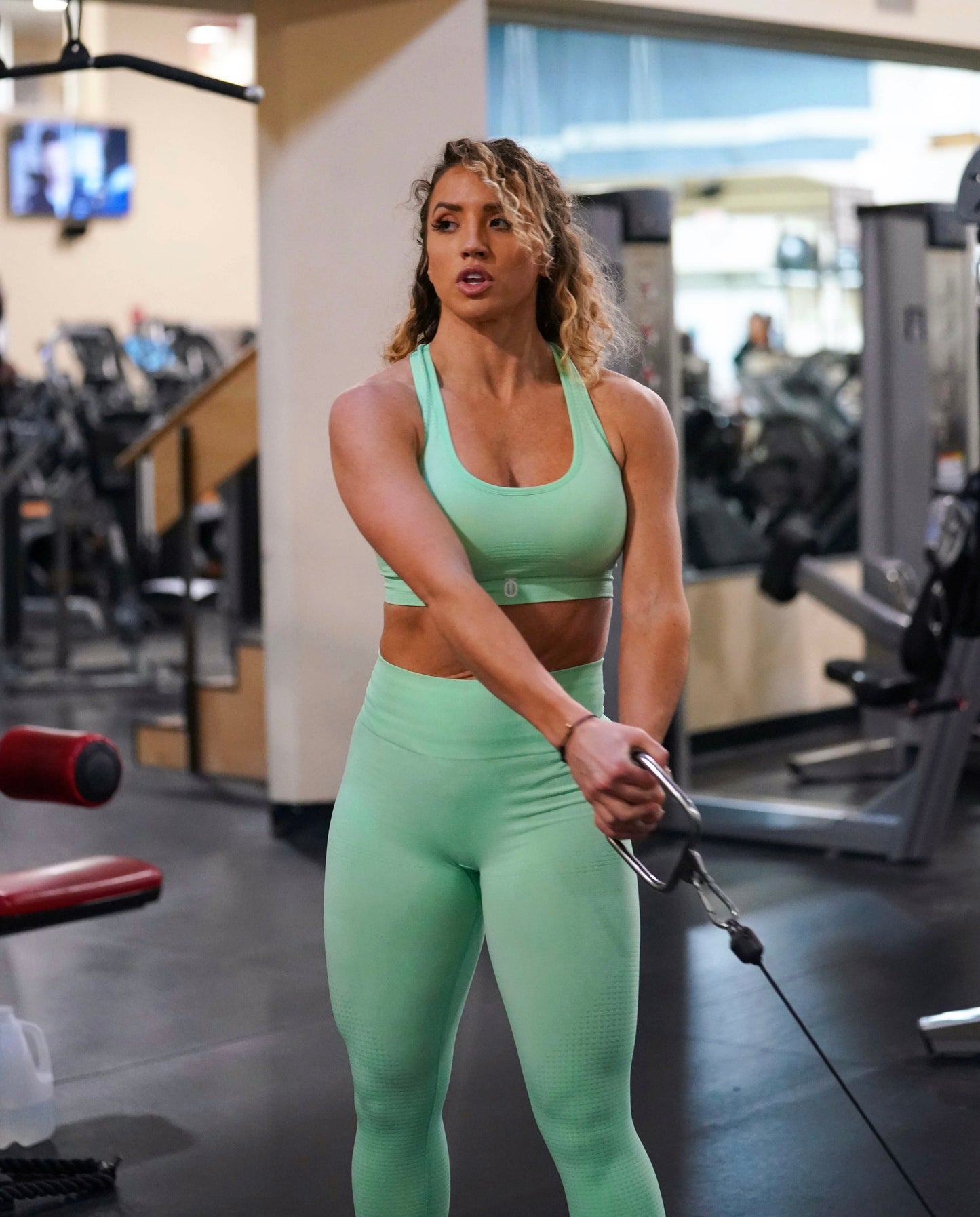 Take One Empower Sports Bra offering medium to high support, breathable mesh panels, and adjustable straps for comfort during intense exercise