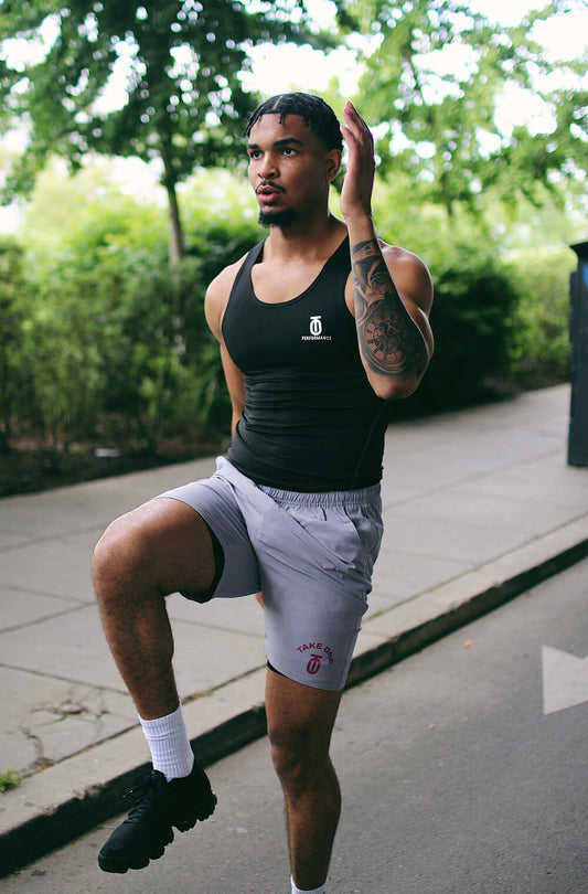 T1 Performance Tank top designed for high-intensity training with moisture-wicking fabric, breathable mesh panels, and athletic cut