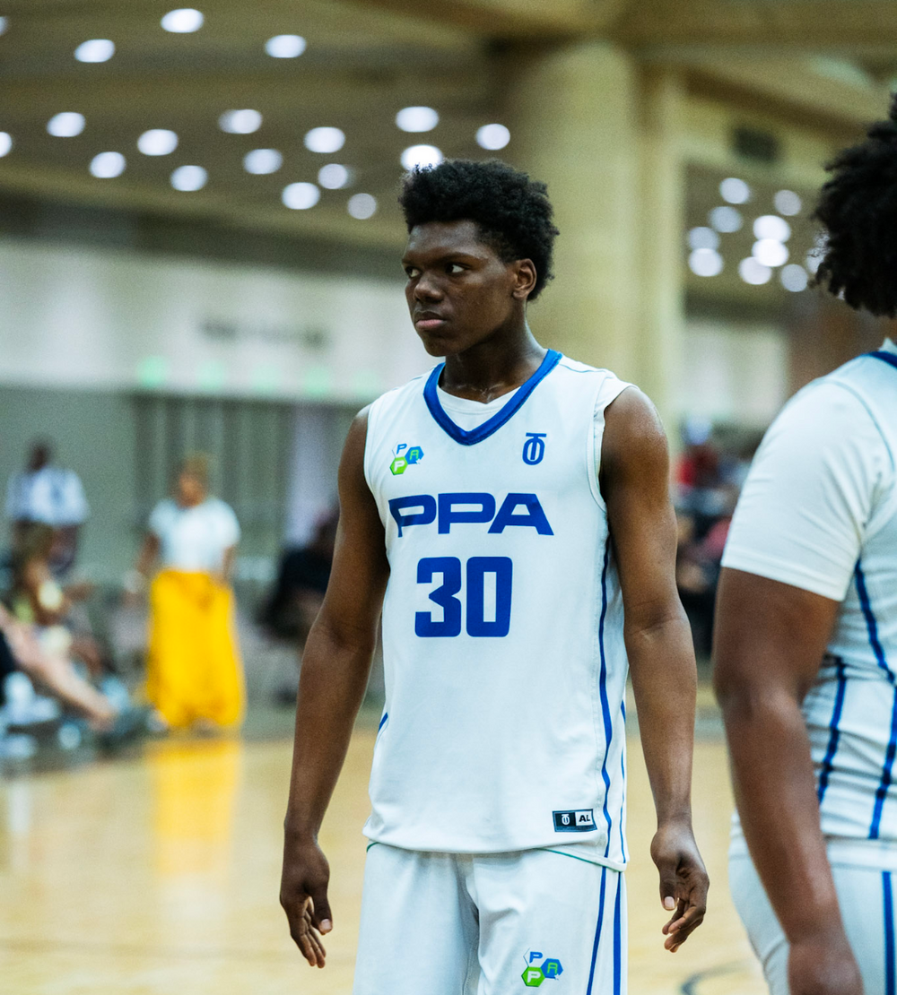Basketball player wearing a custom Take One Sportswear PPA uniform on an indoor court.