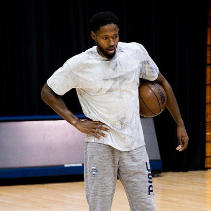 Haywood Highsmith modeling the grey Everyday People Tee by Take One Sportswear during a basketball training photoshoot.