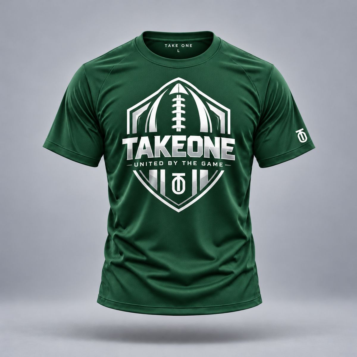 Take One Gridiron Crest Graphic Tee by Take One Sportswear in forest green, front view with original football artwork.