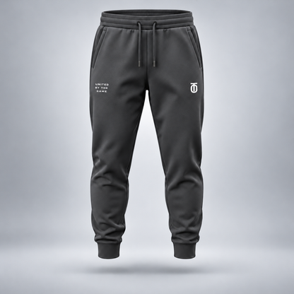 Take One Sportswear charcoal grey Football Performance Joggers front view featuring white TO monogram, United By The Game lettering, and tapered athletic silhouette.