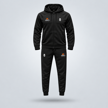 Black Maryland Knights Basketball travel sweatsuit by Take One Sportswear featuring a full-zip hooded jacket and matching joggers with team logos. Neutral grey studio background with a subtle floating shadow.