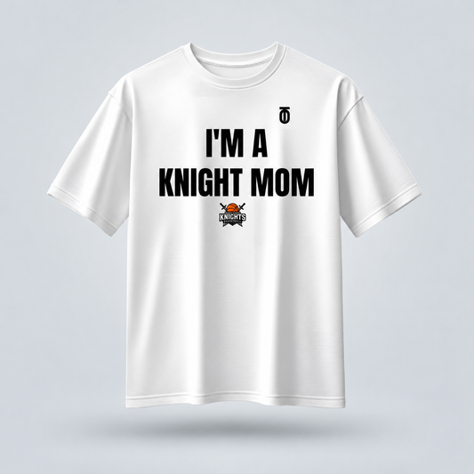 White Maryland Knights Mom supporter T-shirt by Take One Sportswear, featuring black family lettering and the team logo. Neutral grey studio background with a subtle floating shadow.