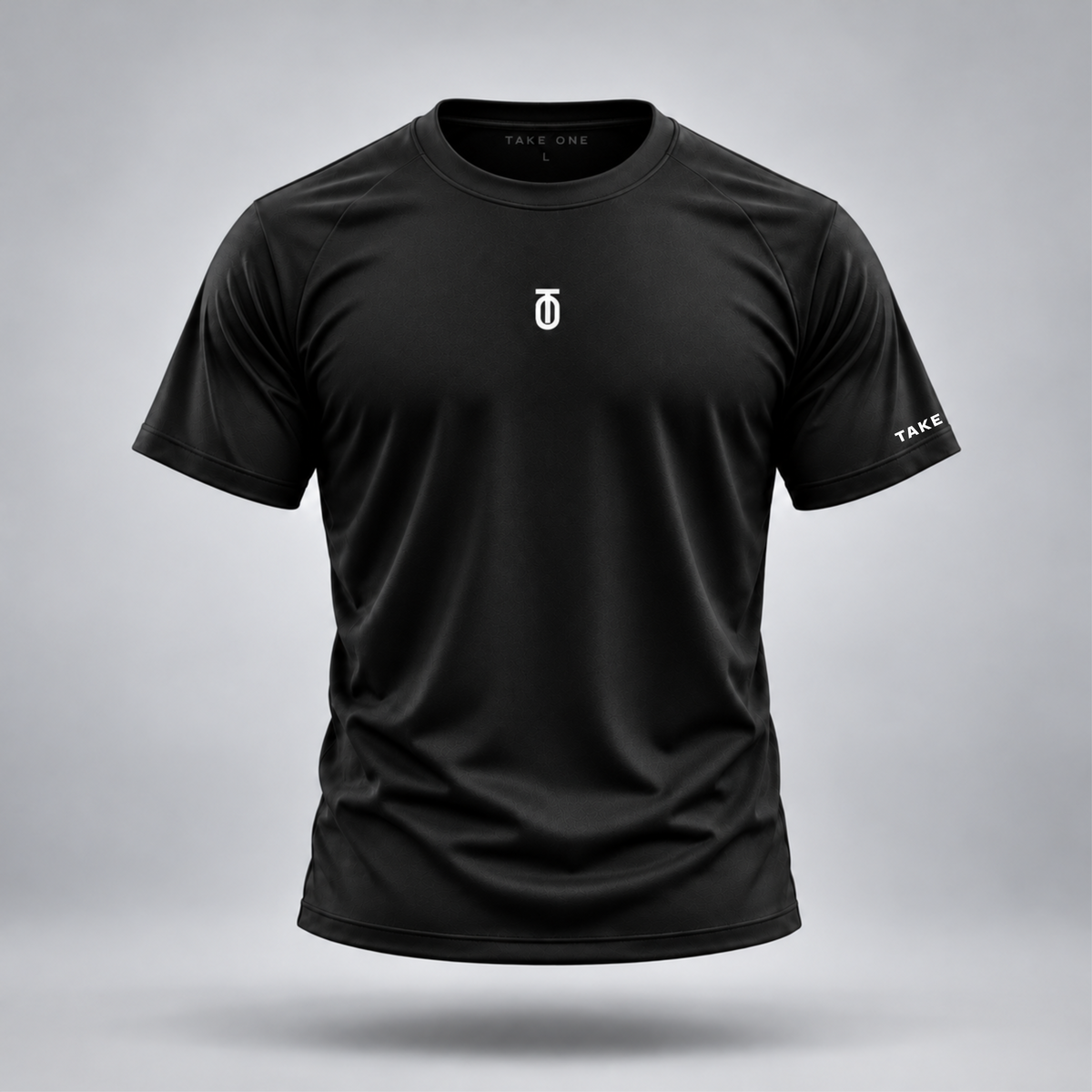 Take One Sportswear Performance Tee in black, front view featuring a white centered TO monogram, TAKE ONE sleeve branding, and athletic crewneck design.