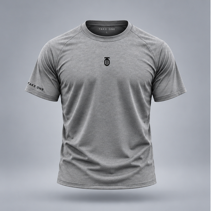 Take One Sportswear Performance Tee in heather grey, front view featuring a black centered TO monogram, TAKE ONE sleeve branding, and athletic fit.