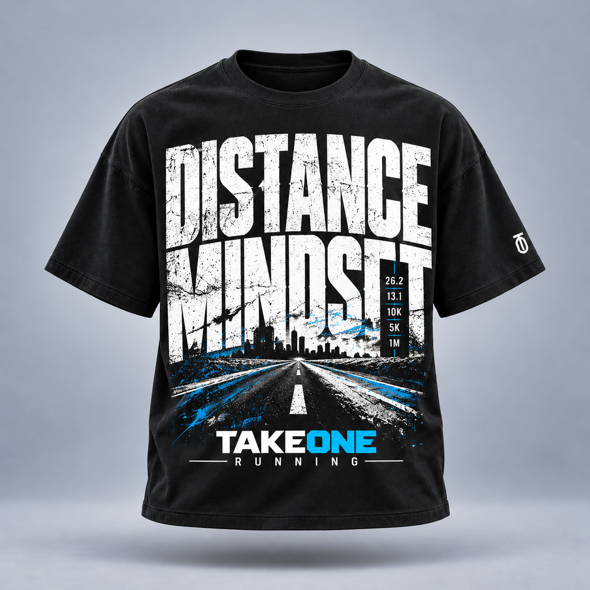 Take One Distance Mindset Graphic Tee by Take One Sportswear in Black, front view featuring bold distance-running typography and TO sleeve branding.