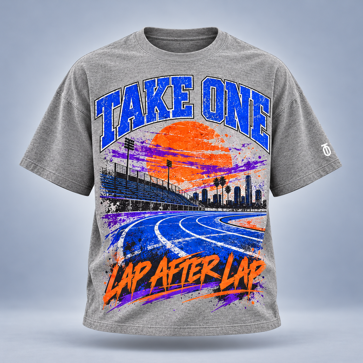 Take One Lap After Lap Graphic Tee by Take One Sportswear in Heather Grey, front view featuring colorful track-oval artwork and TO sleeve branding.